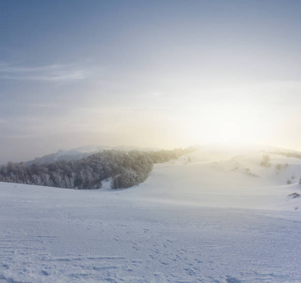 istock winter snowbound hills at the sunset 1203377963