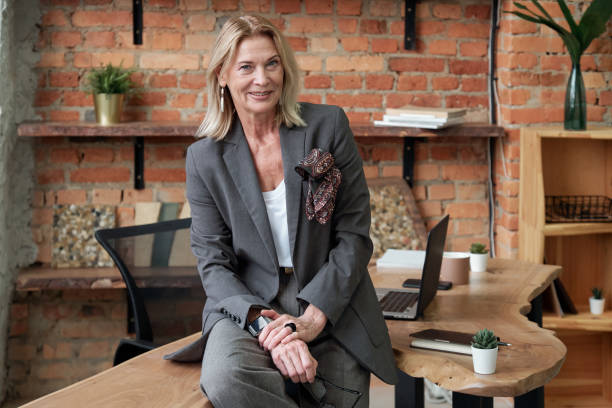 istock Smiling businesswoman in office 1203379208