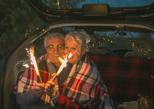 istock Senior couple outdoors with car 1203381218