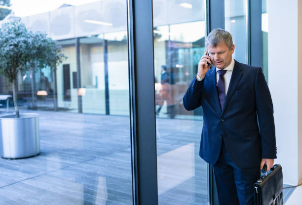 istock Mature Businessman With Smartphone 1203381583
