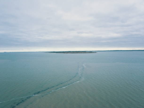 Population 0 tidal road leading to osea island it can only be accessed twice a day. So timing is everything. This captures its remoteness  there is almost a calming sensation when looking at this. The island has a few resorts you can stay to get away from the busy country we live