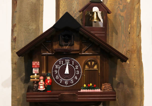 istock beautiful wooden clock on a wooden background 1203382195