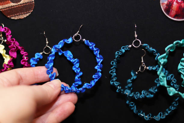 istock handmade multicolored earrings on a shop window 1203382227
