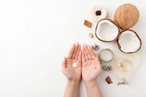 istock organic cosmetics with coconut on white background top view. 1203385160