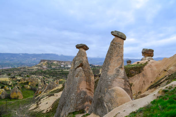istock Fairytale landscape with unusual mountain formations. Three Sisters Rocks in Turkish Cappadocia 1203385630