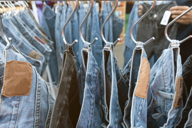 istock Old jeans trousers in a row 1203386600