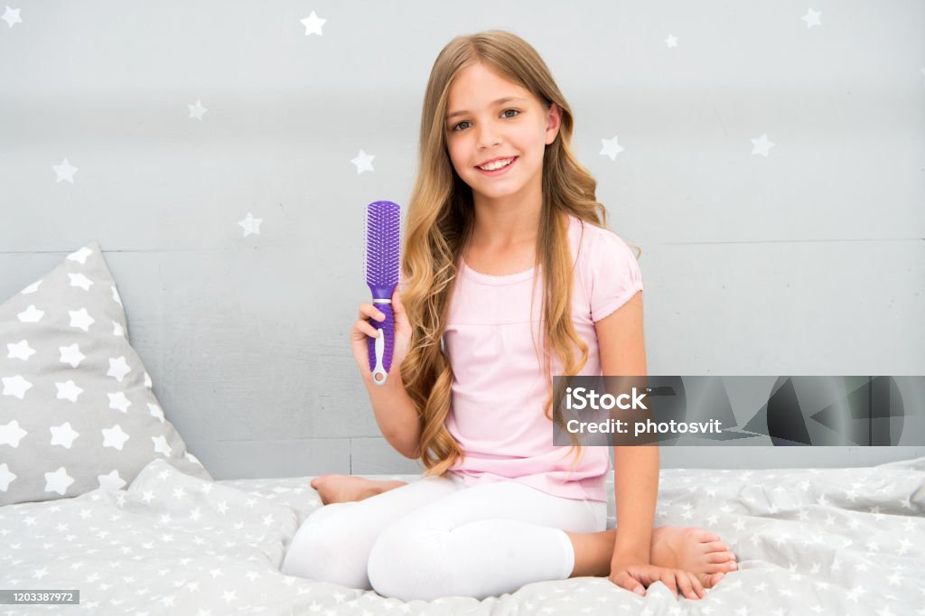 Conditioner Or Mask With Organic Oil To Comb Hair Proper Way Beauty Salon Tips  Girl Child Long Curly Hair Grey Interior Background Child Perfect Curly  Hairstyle Looks Cute Hold Hairbrush Or Comb