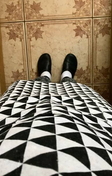 istock Long legs, abstract photo, kitchen apron, black and white 1203389208