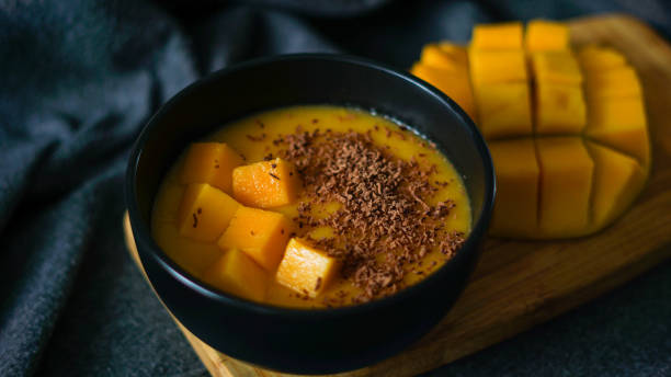 istock Banana-mango mousse with chocolate on a morning 1203390286