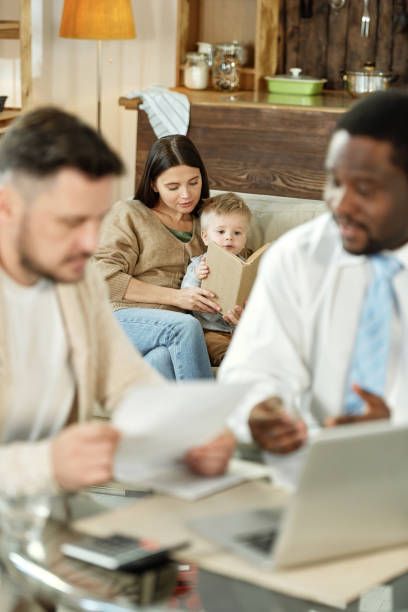 istock Woman with son reading on sofa 1203391803