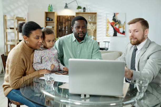istock Advise and ethnic family watching laptop 1203391863