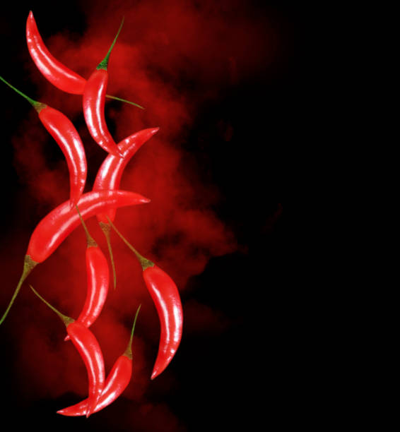 istock red pepper chili   on a black background 1203392618