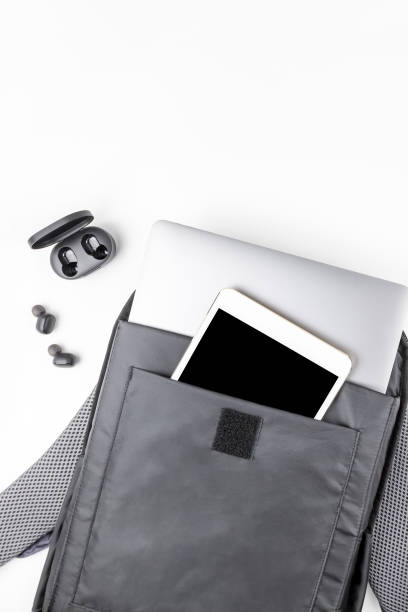 modern backpack with laptop and tablet inside - travel ipad isolated backpack imagens e fotografias de stock