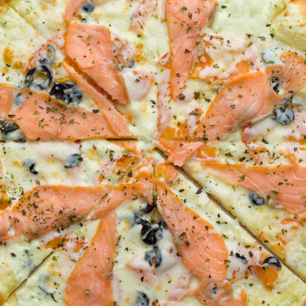 istock Pizza with red fish. Top view isolated on a white background 1203397518
