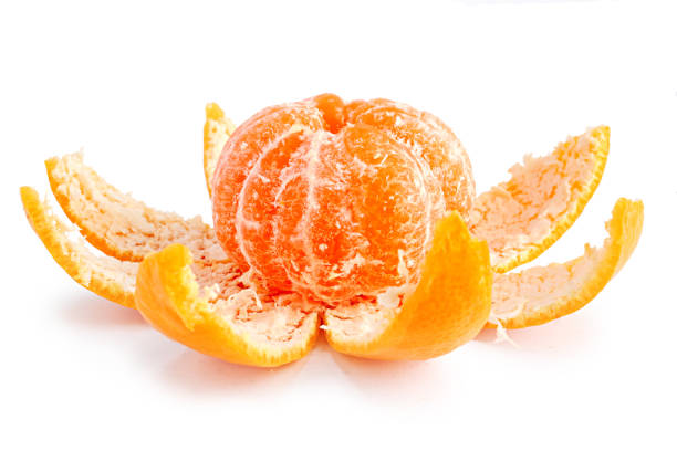 istock Peeled mandarin orange isolated on white background 1203397653