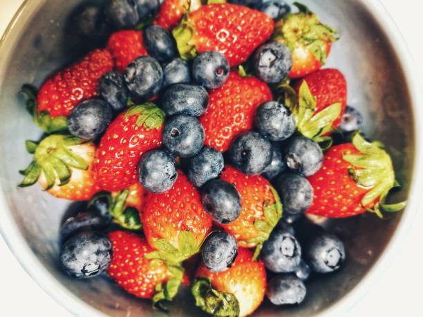 Strawberry and blueberry on a white plate