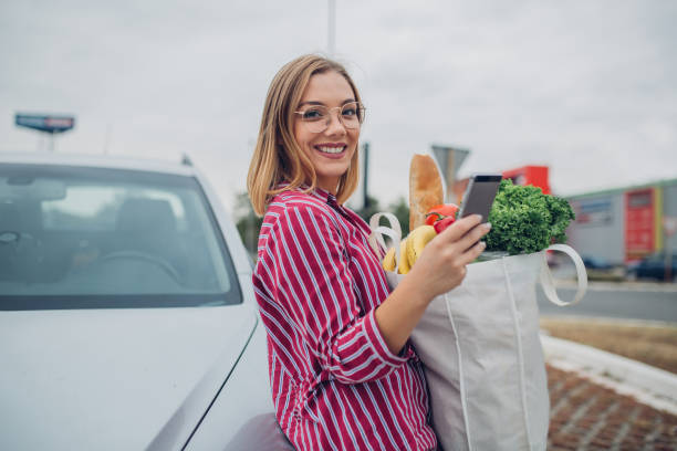 istock Beautiful young woman shopping 1203402332