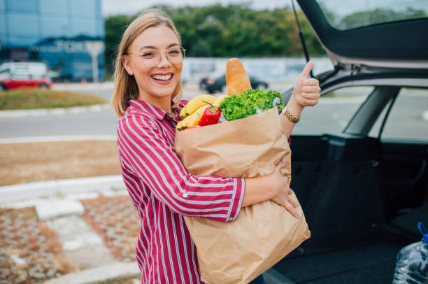 istock Beautiful young woman shopping 1203402335
