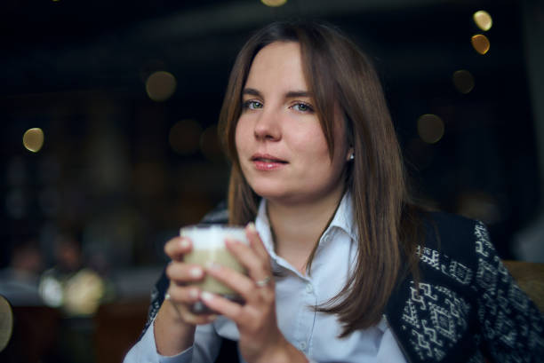 Young woman in a cafe stock photo