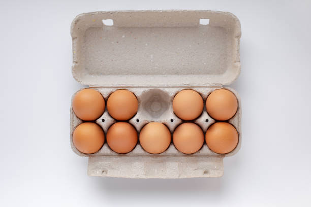 istock chicken brown eggs in a tray, no one egg, top view 1203403660