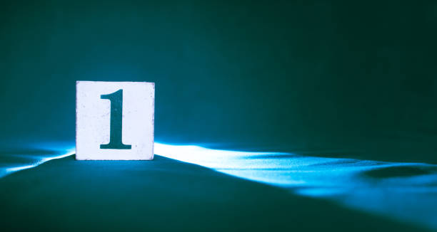 istock Block with number 1, one, on a dark blue background 1203403761