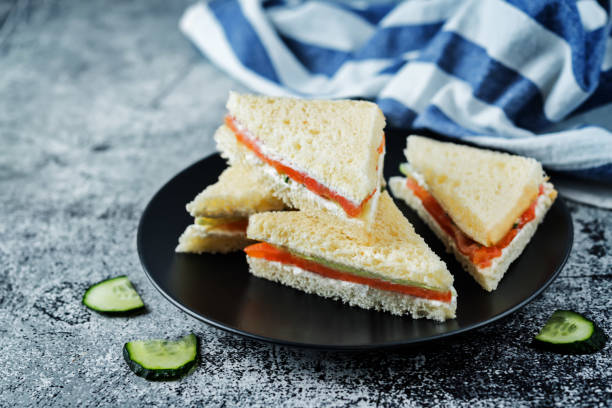 istock Smoked salmon ricotta cheese cucumber tea sandwiches 1203408243