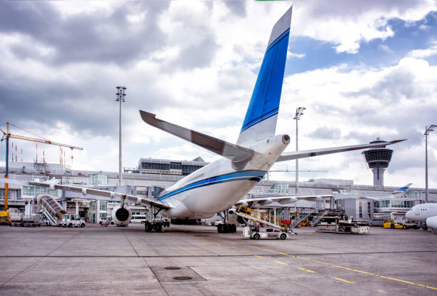 istock Loading of big aeroplane at airport. 1203409112