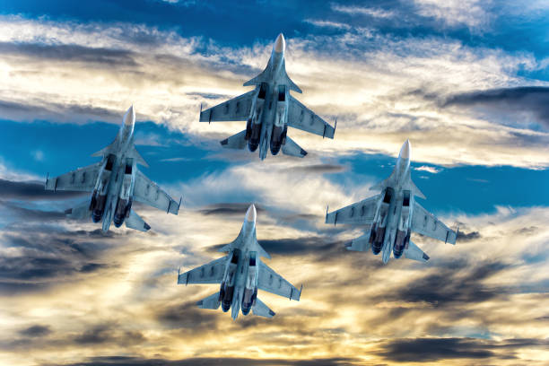istock Fighter aircrafts taking off in the sky at sunset. 1203409937