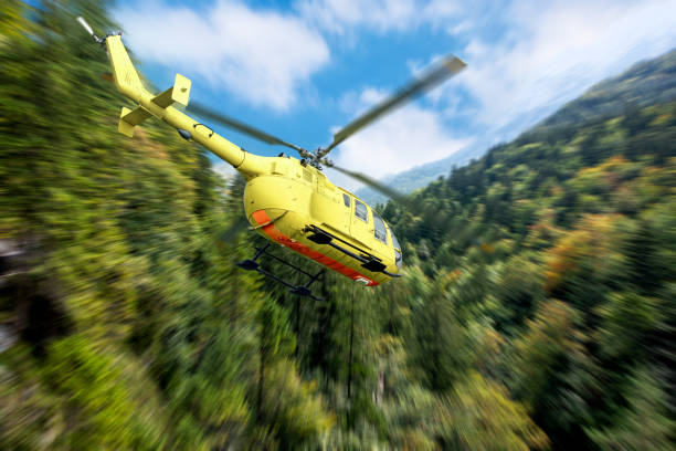 istock Yellow helicopter on background of high Alps mountains. 1203410003