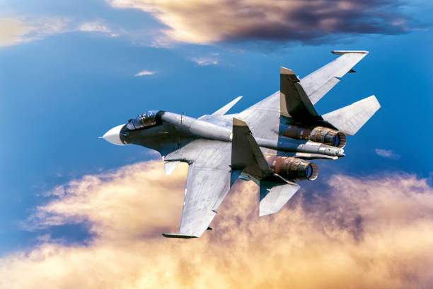 istock Fighter aircraft taking off in the sky at sunset. 1203410086