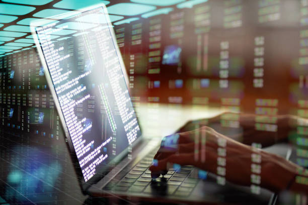 istock Woman's hands working on laptop in data center 1203416008