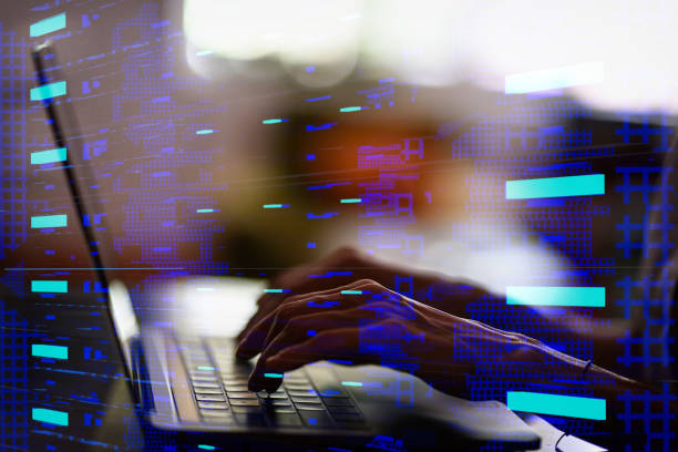 istock Woman's hands working on laptop in data center 1203418182