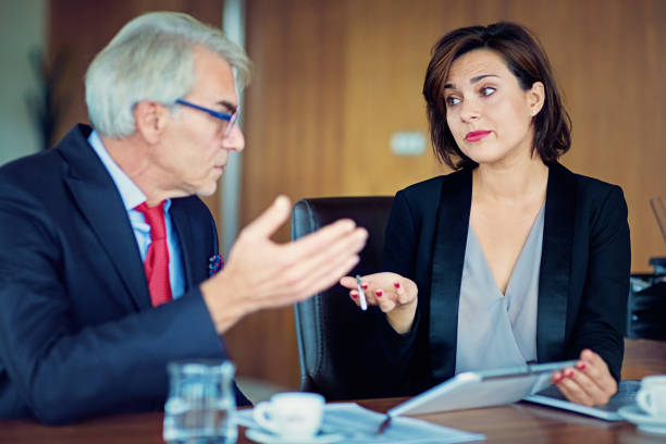 istock Manager is discussing with colleague in the office 1203418461
