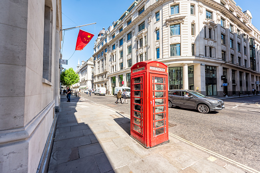 London, UK - June 26, 2018: Bank of china in business center architecture wide angle view with red telephone booth