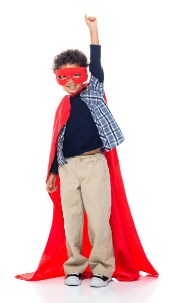 istock Boys superhero standing wearing eye mask 1203423418