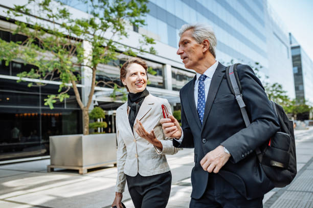 istock Mature Latino business people going home after work 1203426196