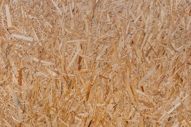 istock close up pressed wooden panel background, seamless texture of oriented strand board - OSB wood - Image 1203426507