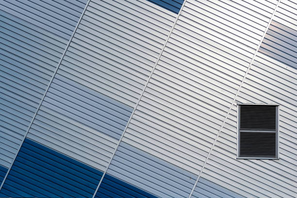 istock Abstract architectural background from modern buildings facade with blue and silver lines - image 1203426530
