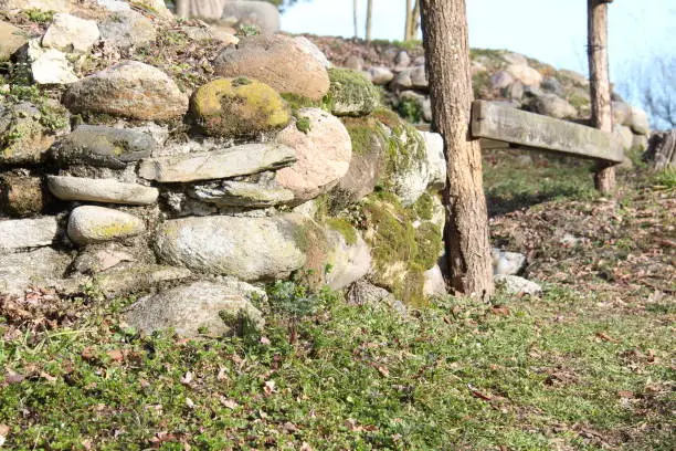Small dry stone wall in an ancient building.