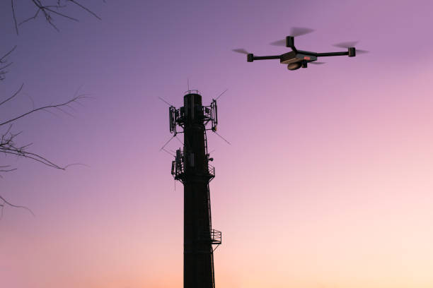 istock cellular signal tower inspecting drone 1203427568