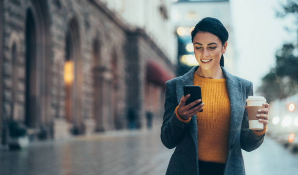 istock Texting in the city 1203433739