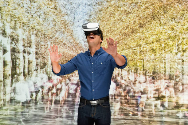 istock Young male in blurred motion who is outdoors and using virtual reality 1203433992