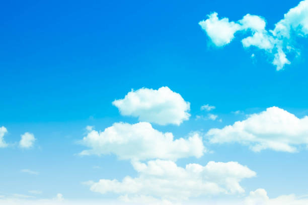 istock Blue sky background and white clouds in the air. 1203435349