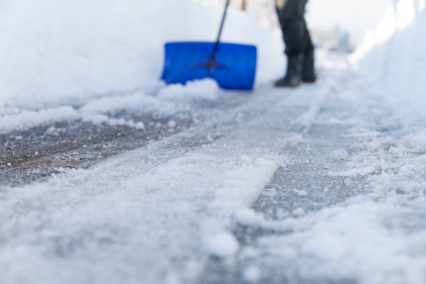 snow removal man removing snow pavement stock pictures, royalty-free photos & images