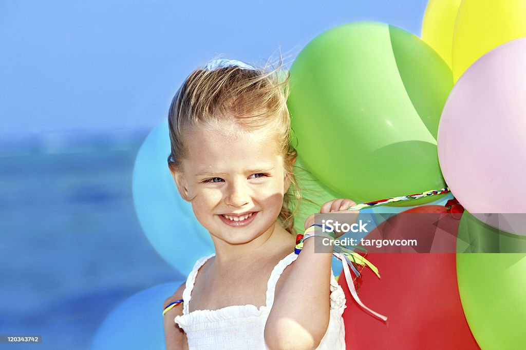 Child playing with balloons . Little girl playing with balloons . Balloon Stock Photo