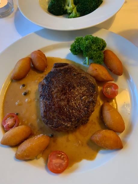 istock Steak with fritters and broccoli 1203440098