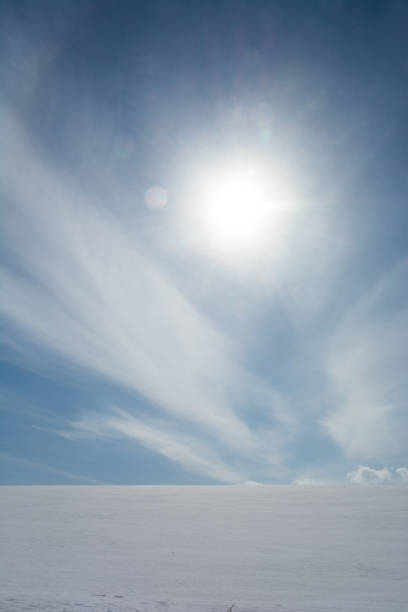 istock Snow field and winter sun 1203440111