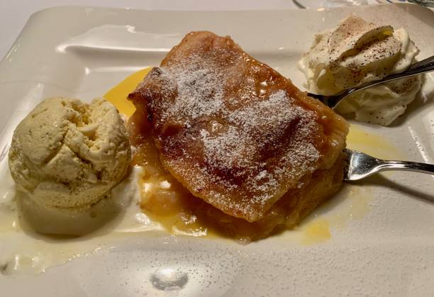 istock Apple strudel served with ice cream and sweet sauce 1203440358