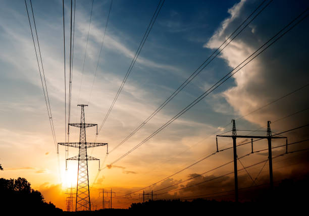 istock High-voltage power lines at sunset or sunrise. High voltage electric transmission tower 1203441177