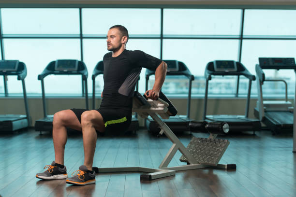 istock Man Doing Exercise For Triceps On Roman Chair 1203441661